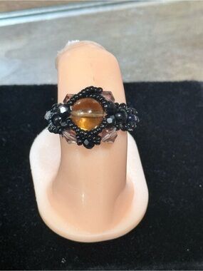 Handcrafted Black Beaded Ring with Amber Glass Center